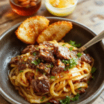 A vibrant plate featuring stir-fried ground beef mixed with rich sauce, atop a bed of tender noodles garnished with chopped green onions and sesame seeds, styled simply on a rustic wooden surface.